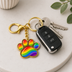 Exklusiver Pfoten Schlüsselanhänger – Regenbogen Pride Edition – Gold-Optik – ProudYou